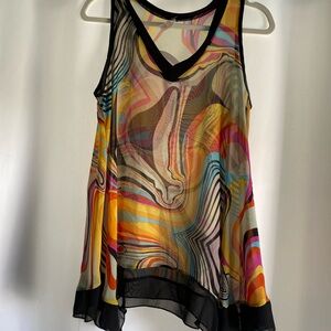 Bright colors swirling around a light transparent fabric